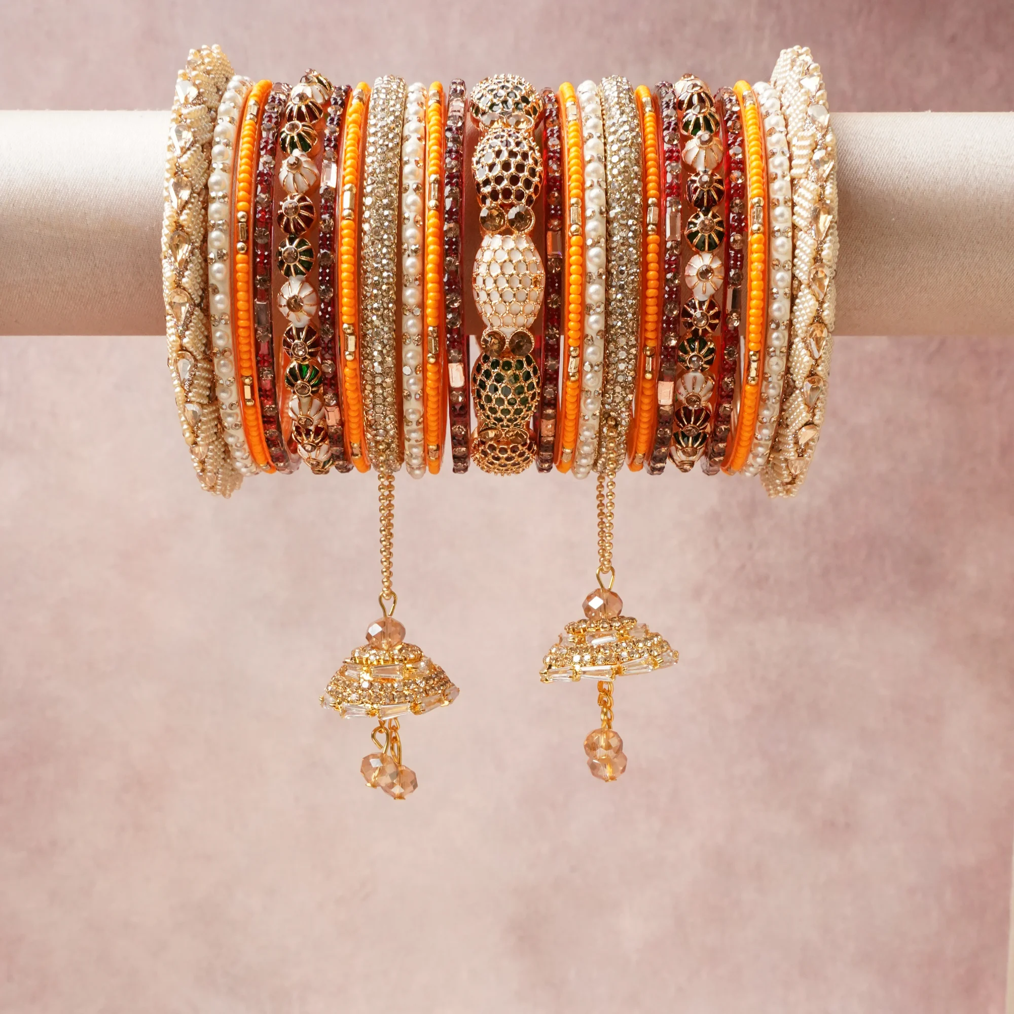 A commanding Gold anchors this beautiful set, enriched with accents of Pearl White, Champagne Crystal, Emerald Green that add depth and dimension.

Featuring a striking composition of Gold-Toned Metal, Pearls, Glass Beads, Cubic Zirconia, Enamel, Lac/Resin, this set carries intricate craftsmanship and strong presence. Grand in form, it is created for moments that deserve to be marked.